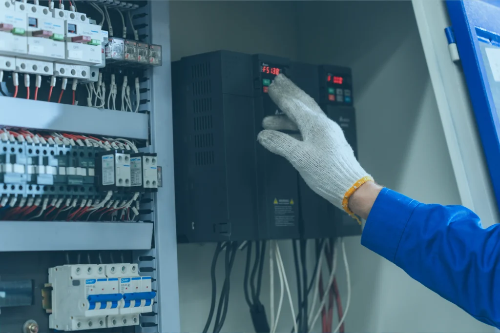 Worker controlling the speed using VFD